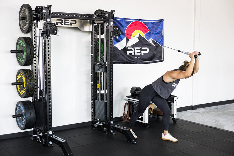 power rack with front foot extension pair 2.0 adding stability to front of rack while someone use cable machine attachment for tricep extensions