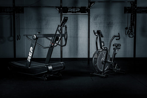 The Strive™ Air Bike and Curved Tread in the REP gym.